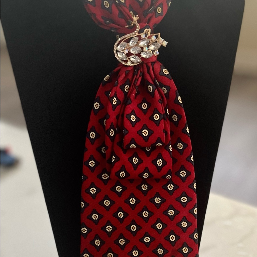 Red Patterned Necktie necklace with Jeweled swan Brooch